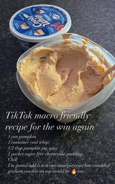 there is a bowl of ice cream next to a container of yogurt