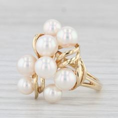 Gemstone Information: - Cultured Saltwater Pearls - Size - 4.6 - 5.1 mm  Cut - Round Bead Shape Color - White Metal: 18k Yellow Gold Weight: 5.1 Grams  Stamps: 750 Face Height: 18.8 mm  Rise Above Finger: 9.6 mm Band / Shank Width: 1.5 mm This ring is a size 6 1/4, but it can be resized down 2 sizes for a $20 fee or up 3 sizes for a $40 fee. If you would like your ring resized, please select the appropriate fee from the listing below in order to pay the sizing fee: https://www.etsy.com/listing/781388346/ring-sizing-service-fee Each piece is thoroughly examined and refinished as needed by our professional jewelers, graded by our in-house GIA (Gemological Institute of America) Graduate Gemologist, and inspected for quality before being carefully packaged and promptly shipped. [SKU: A6896] ph Luxury White Cluster Pearl Ring, Formal Yellow Gold Multi-stone Pearl Ring, Formal White Multi-stone Pearl Ring, Luxury Multi-stone Pearl Ring Fine Jewelry, Mens Custom Jewelry, Pearl Cluster Ring, Saltwater Pearls, Pearl Cluster, Recycled Jewelry