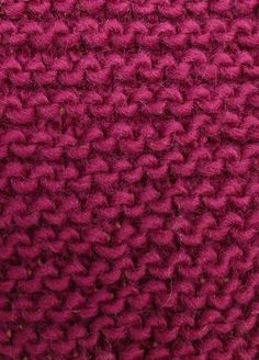 closeup of the crochet pattern on a red sweater