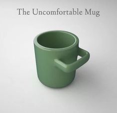 a green coffee cup sitting on top of a white table next to the words, the uncomfortableable mug