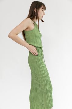 Featuring a halter necklace and two front pockets, the Twisted Maxi Halter Dress is so easy to throw on with a pair of heels or flat sandals. Effortless and chic, it also has a shorter hemline in front to show off your shoes. Matching tie to wear it belted on the waist or loose and flowy. 100% Polyester Gentle cold water wash separately with like colors. Line dry. Do not iron or tumble dry. Lovingly made in Los Angeles. Model is 5'7 and wearing size S. Viscose Halter Neck Maxi Dress, Chic Midi Halter Dress For Daywear, Chic Summer Halter Dress For Daywear, Shoes Matching, Maxi Halter Dress, Your Shoes, Flat Sandals, Matcha, Halter Dress