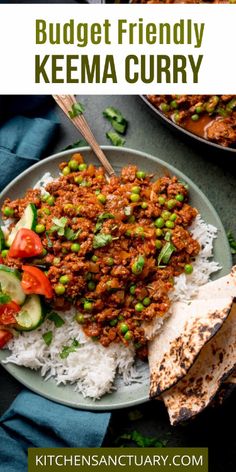 a plate filled with rice, meat and vegetables next to a bowl of sauce on the side