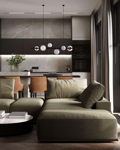 a living room filled with furniture next to a kitchen