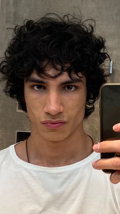 curly head boy, mixed boy, black haired boy, mirror pic, white shirt with curly boy Medium Hairstyles For Men, Fade Undercut, Curly Hair Model, Grow Your Hair Faster, How To Grow Hair