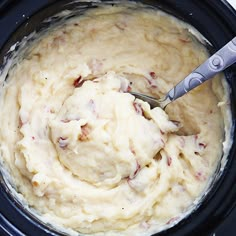 a crock pot filled with mashed potatoes