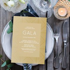 a place setting with silverware and flowers