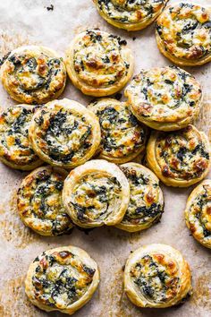 baked spinach and cheese appetizers on a baking sheet, ready to be eaten