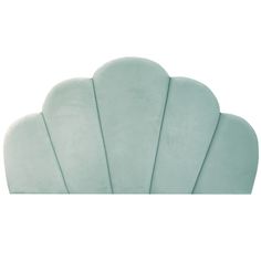 the back side of a blue scallop shaped headboard on a white background