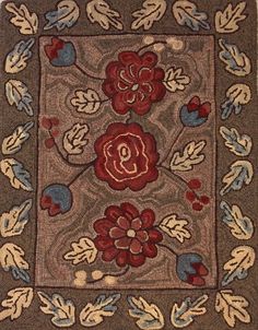 a square rug with flowers and leaves on the center in brown, blue, red and beige colors