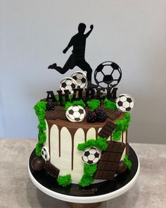 a soccer themed birthday cake on a table