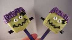 two cake pops decorated to look like monsters