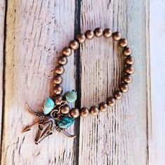 This southwest longhorn copper bracelet is crafted with copper beads, turquoise stone accents and a antique copper longhorn skull.   All Sweet Bella jewelry is handmade with quality materials. Longhorn Skull, Copper Bracelet, Antique Copper, Turquoise Stone, Arm Band, Beaded Bracelet, Etsy Accessories, Accessory Gift, Beaded Bracelets