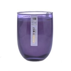 a purple glass with a label on it