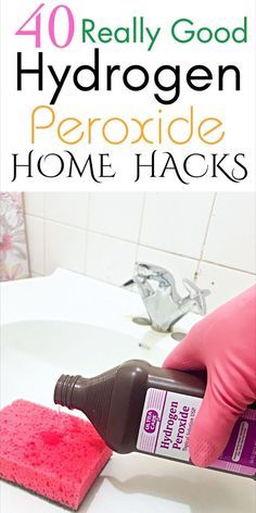 a person in pink gloves is cleaning a white counter top with a sponge on it