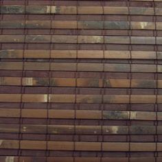 a close up view of the side of a building made out of wood planks