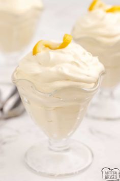 two desserts in small glass dishes on a table