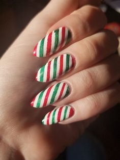 35 Funkiest Striped Nail Art Ideas to Sport the Cool Look Green And Red Candy Cane Nails, Christmas Nails Stripes, Christmas Striped Nails, Red And Green Candy Cane Nails, Christmas Nails Red Green White, Candy Cane Stripe Nails, Red And Green Plaid Nails, Red White And Green Nails, Striped Nail Art