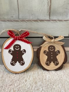 two wood slices with christmas decorations on them