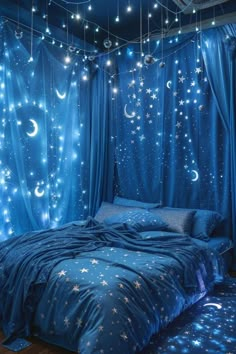 a bedroom with blue curtains and stars on the ceiling