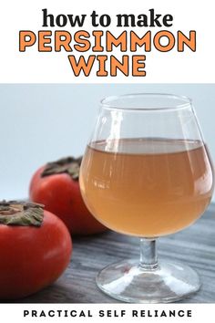 a glass of wine next to tomatoes on a wooden table with text overlay how to make persimmon wine practical self reliance