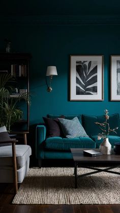 a living room with teal walls and wood flooring is pictured in this image