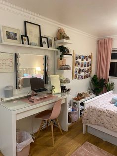 a bedroom with a bed, desk and shelves on the wall next to each other