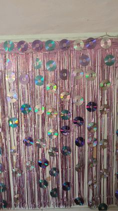 there is a curtain made out of sequins on the side of a wall