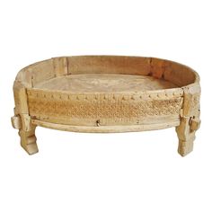 an old wooden tray with carvings on the sides and handles, isolated against a white background