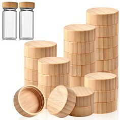 several stacks of wooden spice jars next to each other