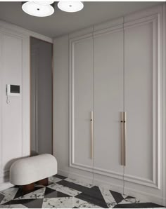 an empty room with white closets and black and white flooring