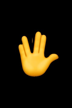 a yellow hand that is on top of a white surface and has two fingers in the air