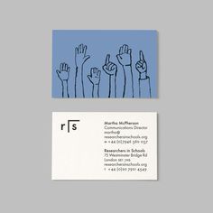 a business card with hand drawn fingers and the letter r is in front of it