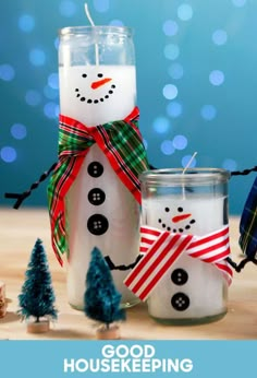 two snowmen made out of mason jars with the words good house keeping written on them