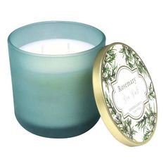 a candle that is sitting in front of a white background with the words rosemary on it