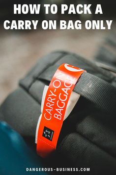 an orange luggage tag with the words how to pack a carry on bag only