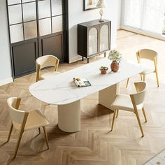 a dining room table with chairs around it