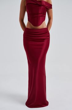 Oh she's luxury! Guaranteed to make you centre of attention, the Bernadette maxi crafted in our premium stretch satin, cut on the bias for a beautiful drape. This one-of-a-kind piece has a pleat detail to the front and diagonal seam at the knee. Pair with the Audra top for a dreamy, luxe look. 



Colour: Burgundy.

Luxury stretch satin fabric.

Fully lined.

Cut on the bias for a beautiful drape.

Pleat detail to front.

Diagonal seam at knee.

Invisible zipper fastening. Maxi length.

 Size: XS, S, M, L, XL, XXL Corset And Maxi Skirt, Stretch Satin Fabric, Split Long Dress, Loungewear Dresses, Maxi Dress Sale, Maxi Dress Navy, Jumpsuit Shorts Rompers, Beautiful Drapes, Stretch Satin