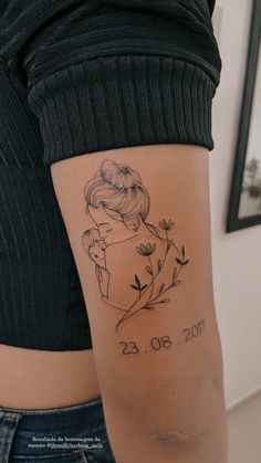 a woman with a tattoo on her arm