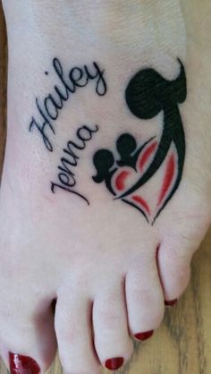 a woman's foot with a tattoo on it that says family and two hearts