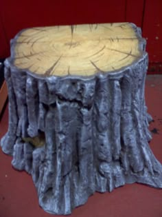 a tree stump sitting on top of a wooden table