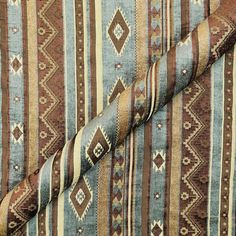 the fabric is very colorful and has brown, blue, and tan stripes on it