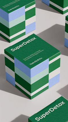 several green and white business cards with the word superdetox on one side