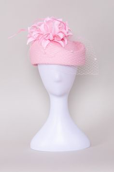 Add a touch of timeless elegance to your ensemble with our classic Timeless Grace Pillbox Hat. This sophisticated accessory is adorned with a matching veil featuring playful pom poms, adding a hint of whimsy to its refined charm. The dainty flower, embellished with shimmering rhinestones, adds sparkle and glamour, while delicate feathers sway gracefully with every movement, elevating your look with a graceful air. NO RETURNS/EXCHANGES due to the nature of the product (special occasions and headw Chic Pink Hat For Wedding, Chic Pink Wedding Hat, Elegant Pink Headpiece With Structured Crown, Pink Mini Hats For Kentucky Derby Ceremony, Formal Mini Hats With Handmade Flowers, Elegant Pink Fascinator For Ceremony, Flower Shaped Mini Hats For Evening, Adjustable Pink Hat For Ceremony, Pink Adjustable Hat For Ceremony