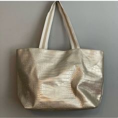 Metallic Gold With White And Gold Cotton Handle. Vegan Leather Fully Lined Open Top Tote Approximate Measurements Width 19” Height 12” Strap Drop 10.5” Super Soft No Tears And Folded. Nwot Never Used. Open Top, Metallic Gold, Saks Fifth, Saks Fifth Avenue, Vegan Leather, Gold Metal, Tote Bag, Leather, Women Shopping