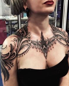 a woman with a tattoo on her chest