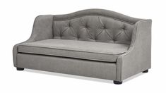 a gray couch with buttons on the back