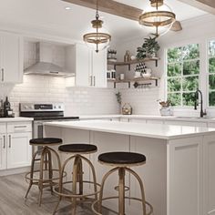 a kitchen with white cabinets and countertops has three stools in front of the island