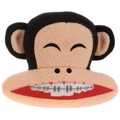 a stuffed monkey with teeth on it's face