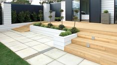 an outdoor area with wooden steps and planters