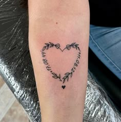 a heart shaped tattoo with the words happy birthday written in it's center surrounded by leaves